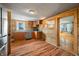 Kitchen area with wood cabinets, stainless steel dishwasher and wood laminate flooring at 3721 S 575 W, Trafalgar, IN 46181