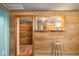 View of the house showing the interior wooden wall paneling and an open view to the kitchen area at 3721 S 575 W, Trafalgar, IN 46181