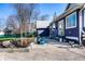 Landscaped backyard featuring a patio with modern furniture, a garden with decorative planters, and a manicured lawn at 3926 Rookwood Ave, Indianapolis, IN 46208