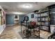 Finished basement with desk space, chair, shelving and rec space at 3926 Rookwood Ave, Indianapolis, IN 46208