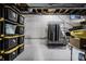 Basement storage with storage tubs and clothing racks at 3926 Rookwood Ave, Indianapolis, IN 46208