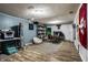 Finished basement with desk space, chair, shelving and rec space at 3926 Rookwood Ave, Indianapolis, IN 46208