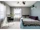 Sunlit bedroom with a comfortable bed, large window, and elegant decor at 3926 Rookwood Ave, Indianapolis, IN 46208