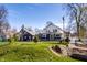 Exterior view of a two-story house with a well-maintained backyard and a blue accent house at 3926 Rookwood Ave, Indianapolis, IN 46208