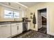 Bright kitchen with stainless steel dishwasher, light countertops, and modern fixtures at 3926 Rookwood Ave, Indianapolis, IN 46208