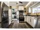Bright kitchen with stainless steel appliances, white cabinets, and modern countertops at 3926 Rookwood Ave, Indianapolis, IN 46208