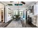 Bright living room featuring hardwood floors, comfortable green sofa, and sliding glass doors for ample natural light at 3926 Rookwood Ave, Indianapolis, IN 46208