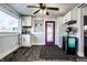 Cozy mudroom with built-in cabinets, a unique purple door, and hardwood floors at 3926 Rookwood Ave, Indianapolis, IN 46208