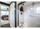 Bright shower with glass door and subway tile, accessible from a modern barn door at 3926 Rookwood Ave, Indianapolis, IN 46208