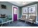 Enclosed sunroom with gray walls, lots of windows, and comfortable seating at 3926 Rookwood Ave, Indianapolis, IN 46208
