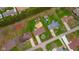 Aerial view of a single-Gathering home outlined in red with a large backyard and mature trees at 3929 Lee St, Anderson, IN 46011