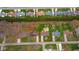 Aerial view of a single-Gathering home outlined in red with a large backyard and mature trees at 3929 Lee St, Anderson, IN 46011