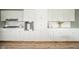 Kitchen wall with stainless steel oven, white cabinetry, and new flooring at 3929 Lee St, Anderson, IN 46011