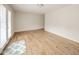 Bright living room with light wood floors and access to outdoor space at 3929 Lee St, Anderson, IN 46011