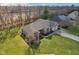 Stunning aerial view of brick home with attached garages and beautifully manicured lawn and driveway at 400 S Prairie Trce, Muncie, IN 47304