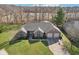 Beautiful aerial view of the brick home featuring a well-manicured lawn at 400 S Prairie Trce, Muncie, IN 47304