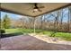 Covered patio area overlooking a lush green lawn and private backyard at 400 S Prairie Trce, Muncie, IN 47304