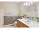 Bathroom featuring a single vanity, shower/tub combo, and decorative wallpaper border at 400 S Prairie Trce, Muncie, IN 47304