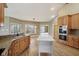 Bright kitchen showcasing wooden cabinets, granite countertops, and a center island at 400 S Prairie Trce, Muncie, IN 47304