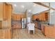 Spacious kitchen featuring wooden cabinets, granite countertops, and stainless steel appliances at 400 S Prairie Trce, Muncie, IN 47304