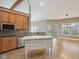 Spacious kitchen boasts wooden cabinets, stainless steel appliances, and white center island at 400 S Prairie Trce, Muncie, IN 47304