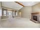Spacious living room with fireplace, vaulted ceilings, and natural light at 400 S Prairie Trce, Muncie, IN 47304
