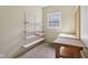 Clean storage room with adjustable shelving and a workbench for organization at 400 S Prairie Trce, Muncie, IN 47304
