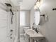 Bathroom featuring a tub-shower combo and pedestal sink at 412 N Riley Ave, Indianapolis, IN 46201