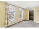 A bright bedroom featuring carpet floors and windows at 412 N Riley Ave, Indianapolis, IN 46201