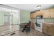 Efficient kitchen featuring cabinets and a dining area at 412 N Riley Ave, Indianapolis, IN 46201