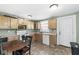 Functional kitchen with wood cabinets, laminate countertops, and appliances at 412 N Riley Ave, Indianapolis, IN 46201