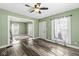 Bright living room with hardwood floors, ceiling fan, and natural light at 412 N Riley Ave, Indianapolis, IN 46201