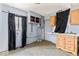 Unfinished kitchen needing remodel showcases cabinets, sink, and window at 5006 W Naomi St, Indianapolis, IN 46241