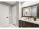 A full bathroom features marble floors, a decorative vanity, and tiled walls at 503 Lockerbie N Cir, Indianapolis, IN 46202
