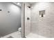 Modern bathroom features a tiled shower with glass door and a recessed niche at 503 Lockerbie N Cir, Indianapolis, IN 46202