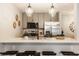 An eat-in kitchen with stainless appliances, a breakfast bar, and decorative pendant lights creates a warm and inviting space at 503 Lockerbie N Cir, Indianapolis, IN 46202