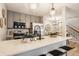 Charming eat-in kitchen with stainless appliances, pendant lights, and a breakfast bar near the stairway to the second floor at 503 Lockerbie N Cir, Indianapolis, IN 46202