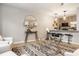 Modern living room with an open floor plan, stylish decor, hardwood floors, and a view of the kitchen at 503 Lockerbie N Cir, Indianapolis, IN 46202