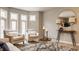 Bright living room featuring modern furniture, hardwood floors, and large windows at 503 Lockerbie N Cir, Indianapolis, IN 46202