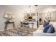 Modern living room with an open floor plan, stylish decor, hardwood floors, and a view of the kitchen at 503 Lockerbie N Cir, Indianapolis, IN 46202