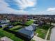Aerial view showcases a home with a firepit and shed in fenced yard within a charming residential neighborhood at 511 Windward Ln, Plainfield, IN 46168