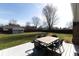 Landscaped backyard with a patio table set for outdoor entertaining at 511 Windward Ln, Plainfield, IN 46168