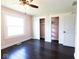 Bedroom featuring wood floors, large window, and large closet at 511 Windward Ln, Plainfield, IN 46168