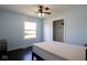 Bedroom featuring wood floors and a large window with closet at 511 Windward Ln, Plainfield, IN 46168