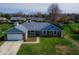 Well-maintained single-story home featuring a brick exterior, attached garage, and a freshly cut lawn at 511 Windward Ln, Plainfield, IN 46168