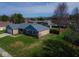 Charming single-story brick home with a well-manicured lawn and a newer gray roof at 511 Windward Ln, Plainfield, IN 46168