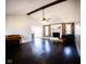 Open living room boasts hardwood floors, vaulted ceilings, and a fireplace with reclaimed wood accents at 511 Windward Ln, Plainfield, IN 46168