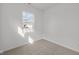 Bedroom with neutral carpet, a window providing natural light and white walls at 5207 Rolling Meadow Blvd, Indianapolis, IN 46237