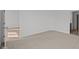Bedroom featuring neutral carpet and white walls with a door at 5207 Rolling Meadow Blvd, Indianapolis, IN 46237