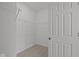 Walk-in closet with white wire shelving and neutral carpet at 5207 Rolling Meadow Blvd, Indianapolis, IN 46237